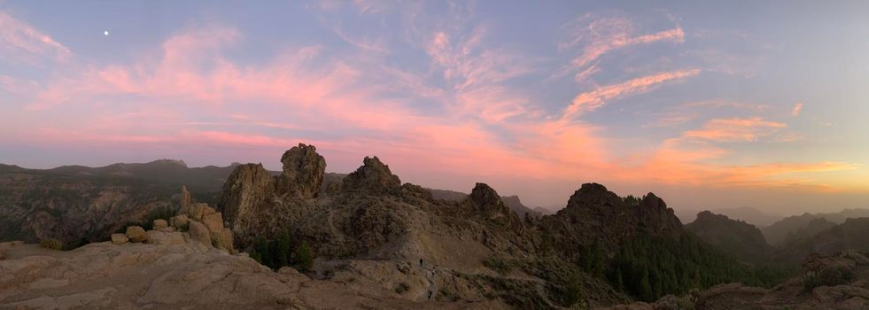 Sunset and pink sky panorama at Roque Nublo the volcanic rock on the island of Gran Canaria