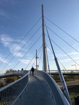 Businessman walking on a bridge in Barcelona, Spain