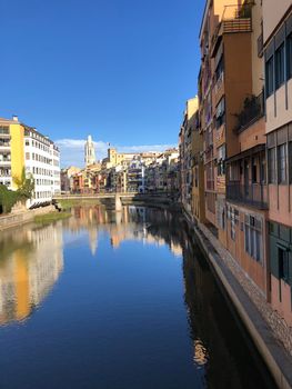 View from the Pont de les Peixateries Velles bridge over the onyar river in Girona, Spain