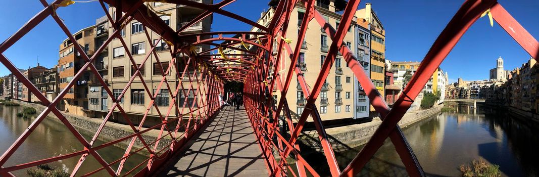 Panorama from the Pont de les Peixateries Velles bridge over the onyar river in Girona, Spain