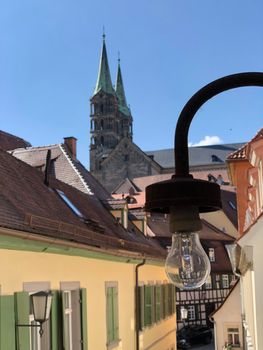 Lantern in the old town with the Bamberg Cathedral in the background in Bamberg Germany