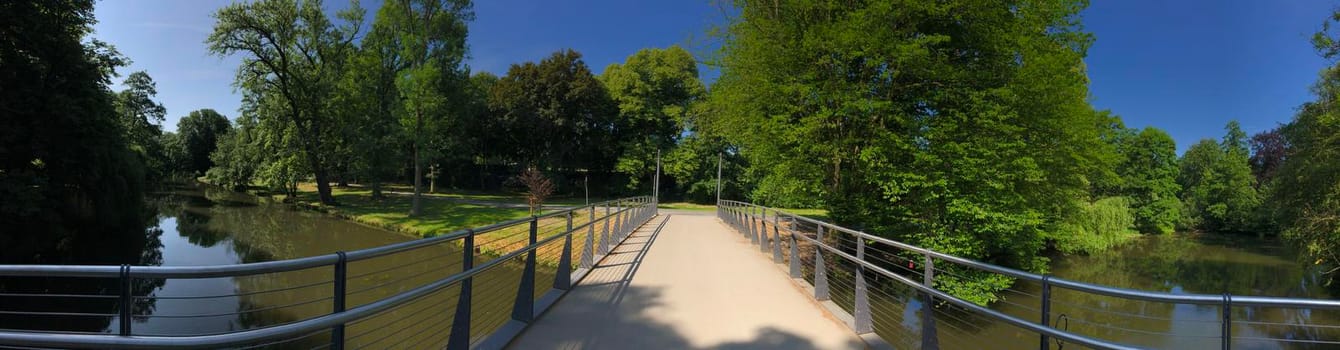 Panorama from a bridge over a river in the Bürger Park in Braunschweig, Germany
