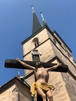 Cross statue in front of the St. Severi church in Erfurt, Germany