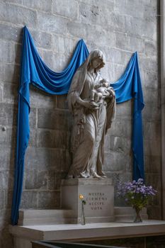Rouen Cathedral Normandy France 9.25.2019 one of the greatest examples of the high gothic church from 13th cent. Very beautiful altar with Mary and baby Jesus with blue drapes. Extensive exterior decoration of the finest quality and the high vaulted ceilings inside with organic ribbing. High quality photo