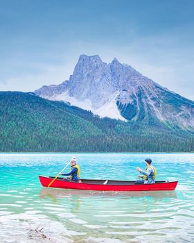 Emerald Lake, Yoho National Park in Canada, Emerald Lake and Tea House, Near Field, British Columbia, Yoho National Park, Canada Mount Burgess can be seen reflected into the water. couple kayak lake