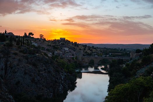 Sunset in Toledo by the river with a cloudy