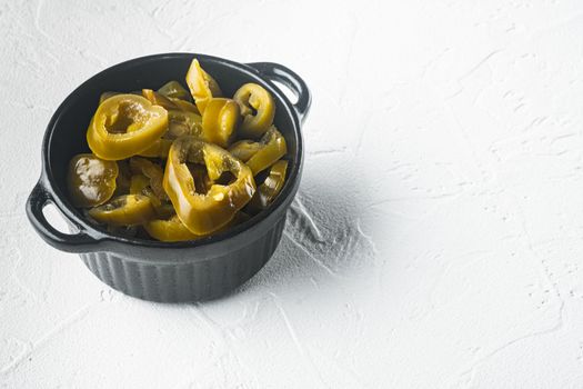 Homemade spicy jalapeno pepper marinated, on white background with copy space for text