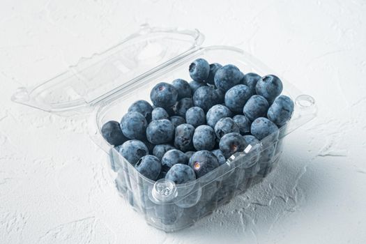 Organic blueberrie in plastic box package, on white background