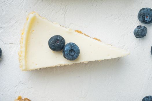Slices Of Classical New York Cheesecake, on white background, top view flat lay