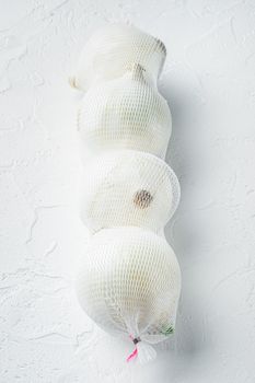 Homegrown white onions, on white background