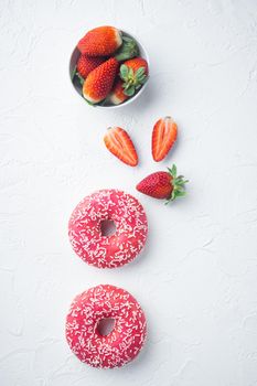 Strawberry Donuts with berrie, on white background, top view flat lay