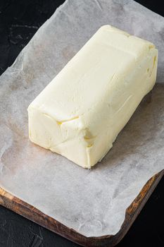 Rustic farmhouse inspired fresh butter, on black background