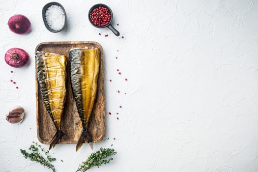 Whole smoked fish mackerel, on white background, top view flat lay with copy space for text