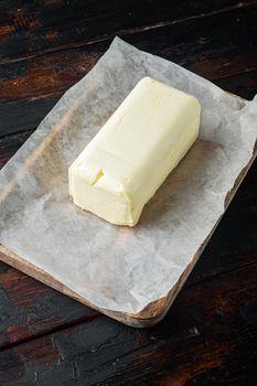 Rustic farmhouse inspired fresh butter, on old dark wooden table background