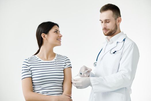 smiling woman in hospital making coronavirus vaccine. High quality photo