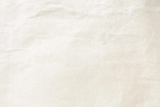 Crumpled soft yellow paper background texture