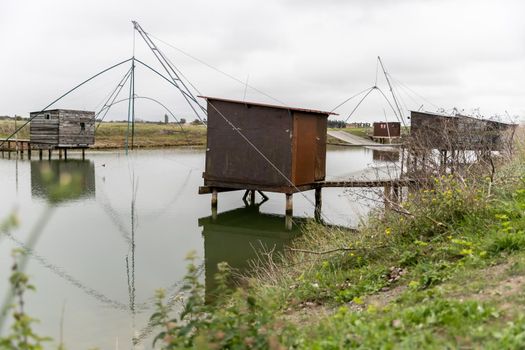 Carrelet de Pêche, the emblematic fisherman's hut of the coastal landscapes of Vendee, Charente-Maritime, in the estuary of La Gironde, La Charente, La Loire or in the Marais Poitevin