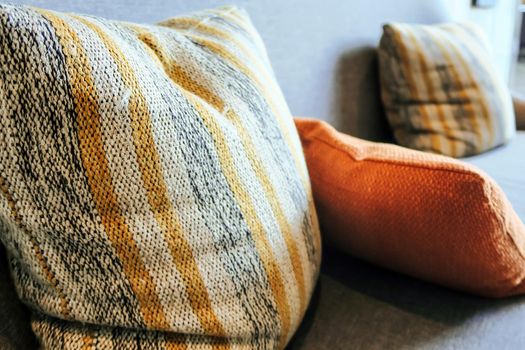 Detail image of cushion on sofa, modern living room.