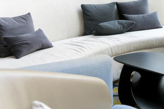Detail image of cushion on sofa, modern living room.