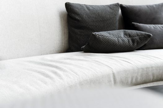 Detail image of cushion on sofa, modern living room.