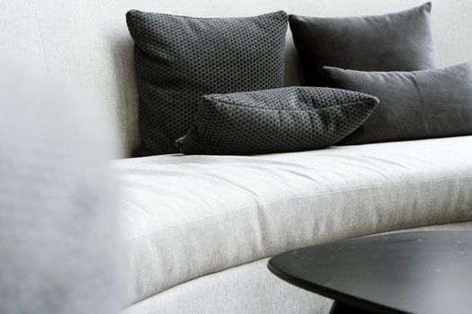 Detail image of cushion on sofa, modern living room.