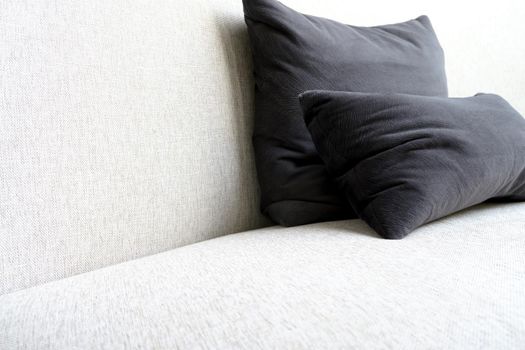 Detail image of cushion on sofa, modern living room.