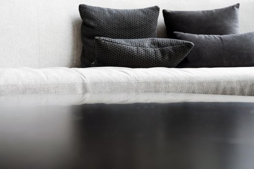 Detail image of cushion on sofa, modern living room.