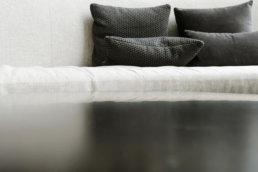 Detail image of cushion on sofa, modern living room.
