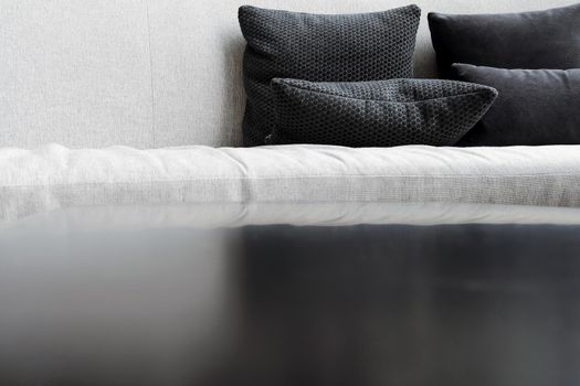 Detail image of cushion on sofa, modern living room.