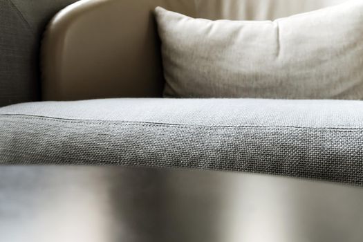 Detail image of cushion on sofa, modern living room.