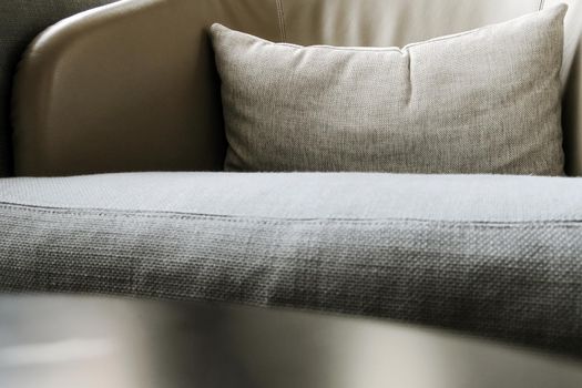 Detail image of cushion on sofa, modern living room.