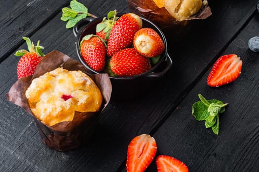 Homemade blueberries muffin, on black wooden table background
