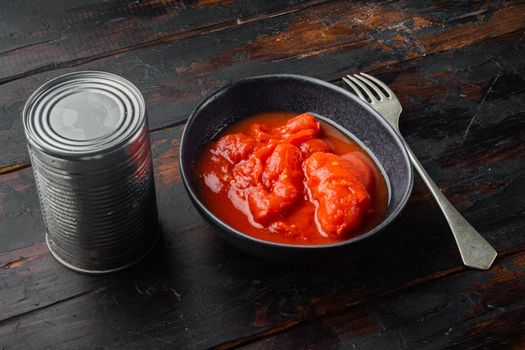 Peeled tomatoe, on old dark wooden table background