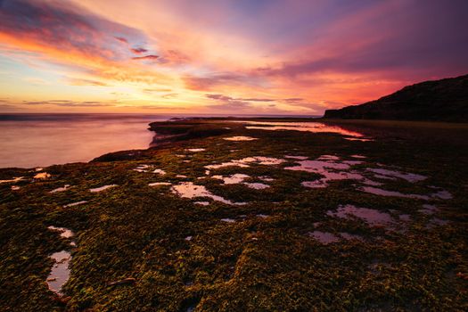 The idyllic Pearses Beach and headland around Pirates Bay Cove on a hot summer's evening near Blairgowrie, Victoria, Australia