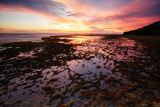 The idyllic Pearses Beach and headland around Pirates Bay Cove on a hot summer's evening near Blairgowrie, Victoria, Australia