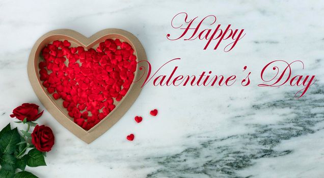 Happy Valentines Day with lovely red rose flowers plus large heart shaped giftbox filled with small hearts on natural marble stone background plus text message