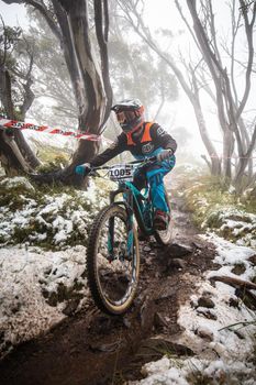 Mt Buller, Australia - January 16 2021: Practice round for the Victorian Downhill Mountain Bike Series after a summer snow storm