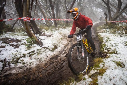 Mt Buller, Australia - January 16 2021: Practice round for the Victorian Downhill Mountain Bike Series after a summer snow storm