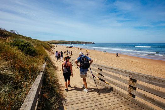 Woolamai, Australia - December 13 2020: Walkers on the iconic Cape Woolamai Surf Beach on Phillip Island, Victoria, Australia