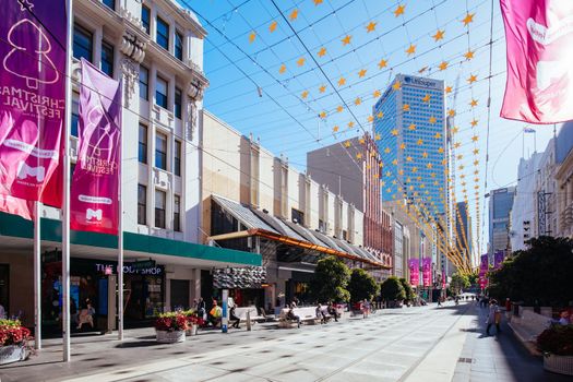 Melbourne, Australia - December 18, 2020: Busy Bourke St Mall with Christmas decorations and festivities in Melbourne, Victoria, Australia