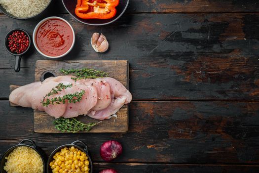 Mexican food ingredients Chicken Enchilada, Rice Casserole, on old dark wooden table background, top view flat lay with copy space for text