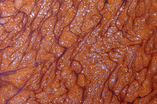 Abstract background texture, brown, liquid acrylic with the addition of gold glitter.