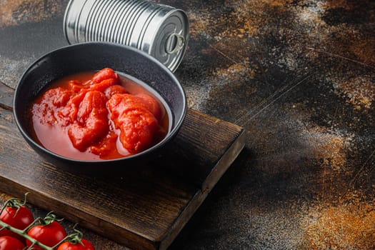 Peeled tomatoe, on old dark rustic background with copy space for text