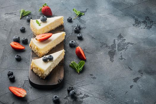 Slices Of Classical New York Cheesecake, on gray background with copy space for text