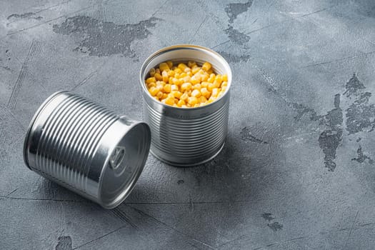 Canned corn in can, on gray background with copy space for text