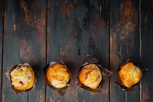 Homemade blueberries muffin, on old dark wooden table background, top view flat lay with copy space for text