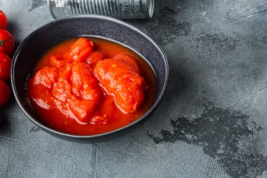 Peeled tomatoe, on gray background with copy space for text