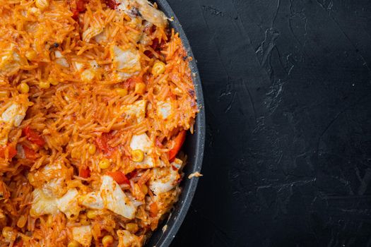 Chicken Enchiladas, Served In Casserole, on black background, top view flat lay