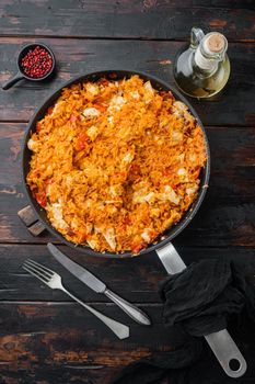 Traditional mexican enchiladas with chicken meat rice and cheese Mexican cuisine., on old dark wooden table background, top view flat lay