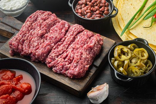 Ingredients for mexican quesadilla with salsa sauce, on old dark wooden table background